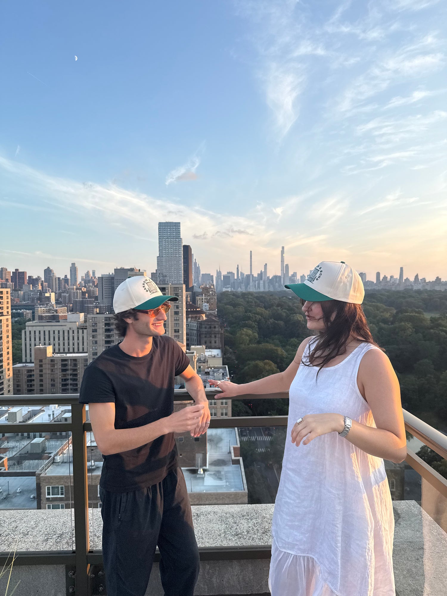 a couple wearing white and green barrow and bond hat 
