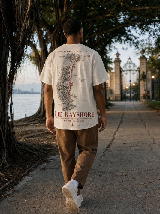 The Bayshore — model on Bayshore Drive Miami under banyan canopy at dawn